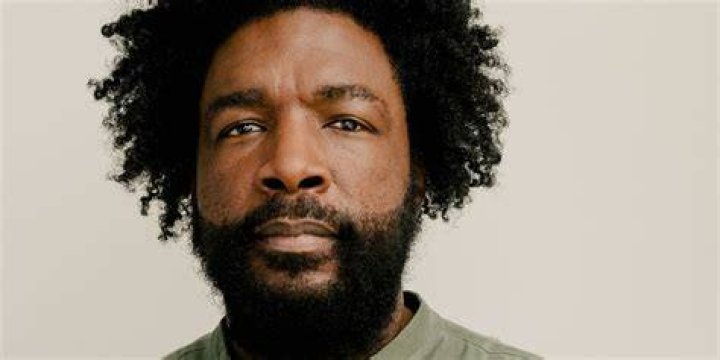 A close-up of Questlove's face looking away from the camera