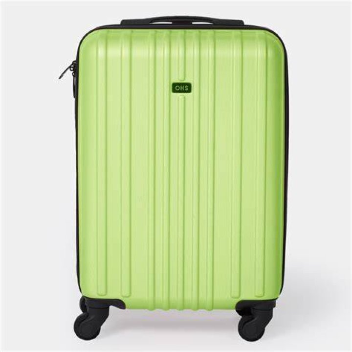 a green suitcase on wheels a green suitcase on wheels