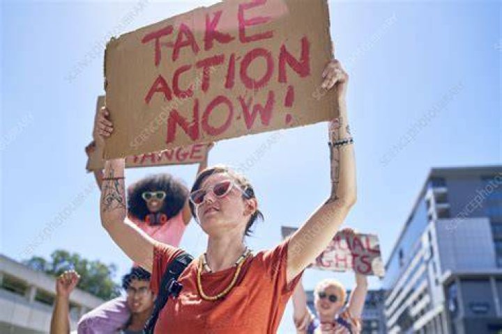 rally a protester holding a sign that reads my body now and forever