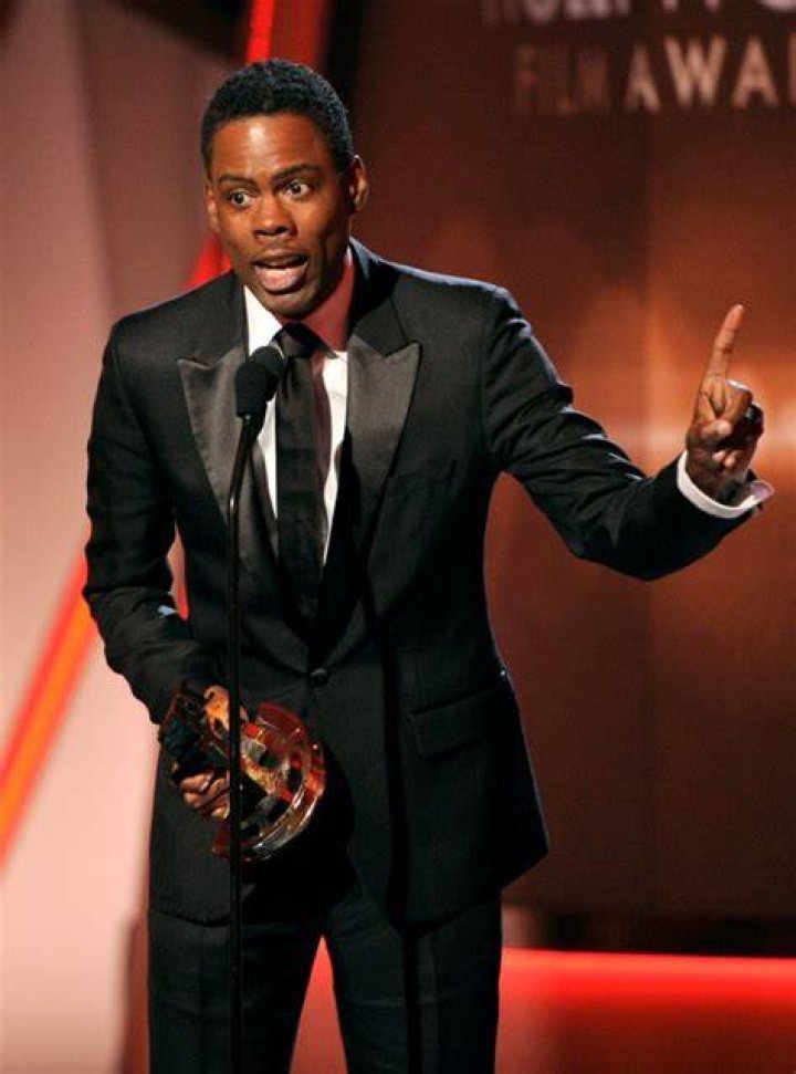 Chris Rock accepts an award.