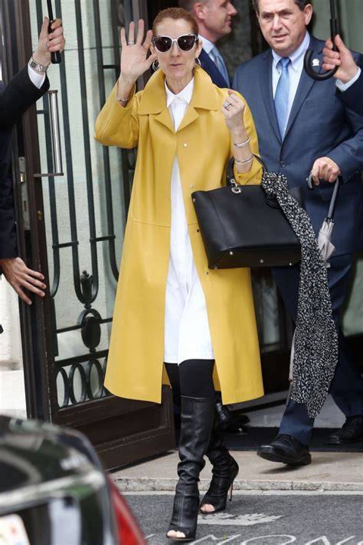 Clothing, Footwear, Eyewear, Leg, Coat, Brown, Trousers, Human body, Shoe, Standing, 