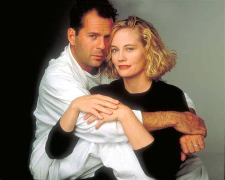 Cybill Shepherd and Bruce Willis smile during an awards ceremony.