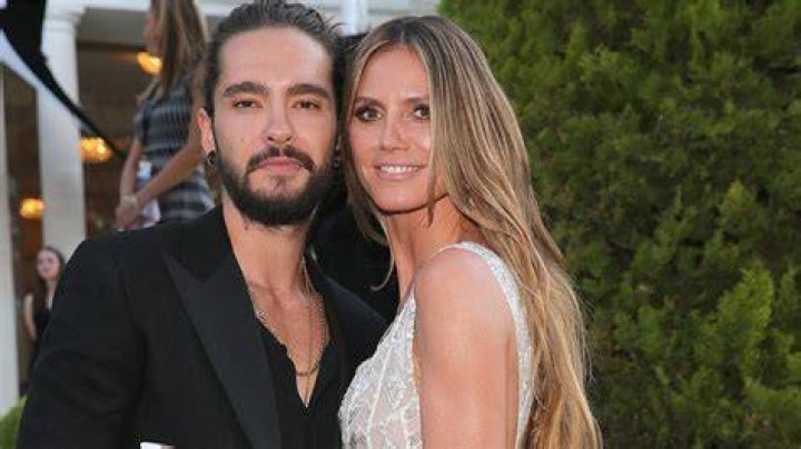 Heidi Klum and Tom Kaulitz pose together on the red carpet at the Elton John AIDS Foundation's Annual Academy Awards Viewing Party