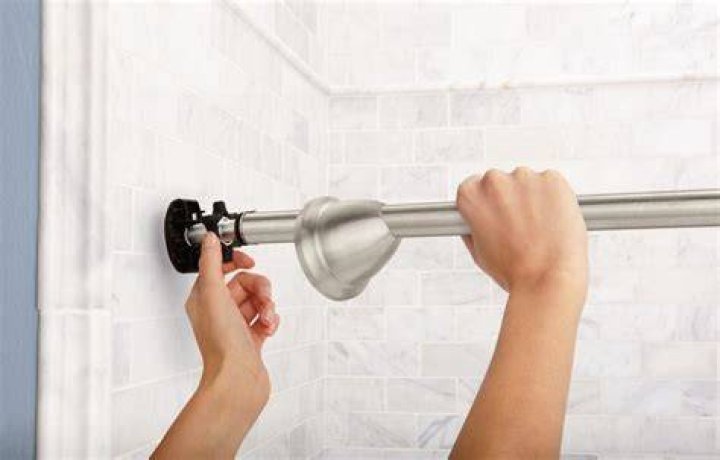 How do you disassemble a tension shower rod?