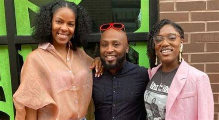 India, Taryn, and Marcus Epps are pictured in a personal photo of themselves smiling in a kitchen drinking wine together on 'Seeking Sister Wife' Season 4 on TLC.