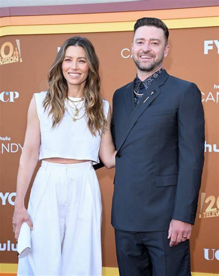 Jessica Biel, Justin Timberlake, and Zooey Deschanel laugh together at the 2024 Vanity Fair Oscar Party