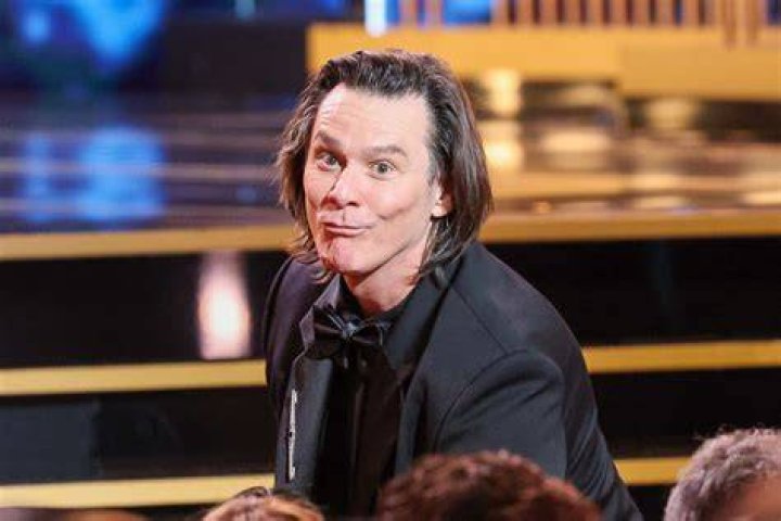 Jim Carrey wears a black and white jacket and t-shirt at a ‘Sonic the Hedgehog" premiere