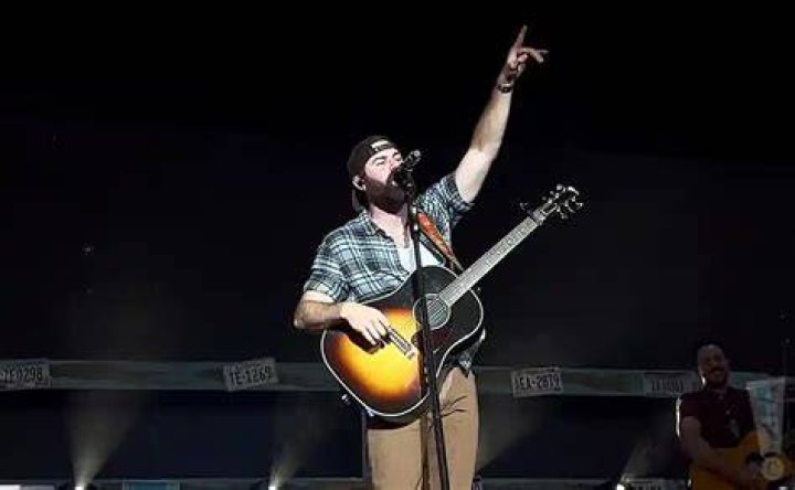 Jordan Davis performing on stage