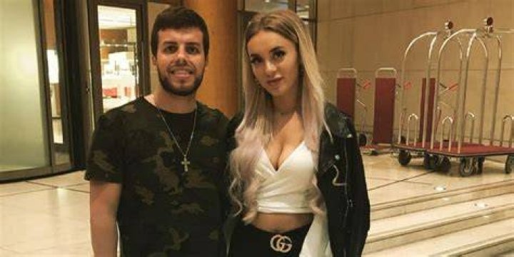 Jovi and Yara of '90 Day: The Last Resort' sitting on a couch during an appearance at a '90 Day Fiance' reunion.
