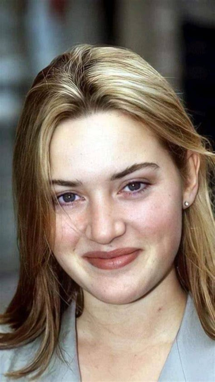 Kate Winslet smiling in a black dress