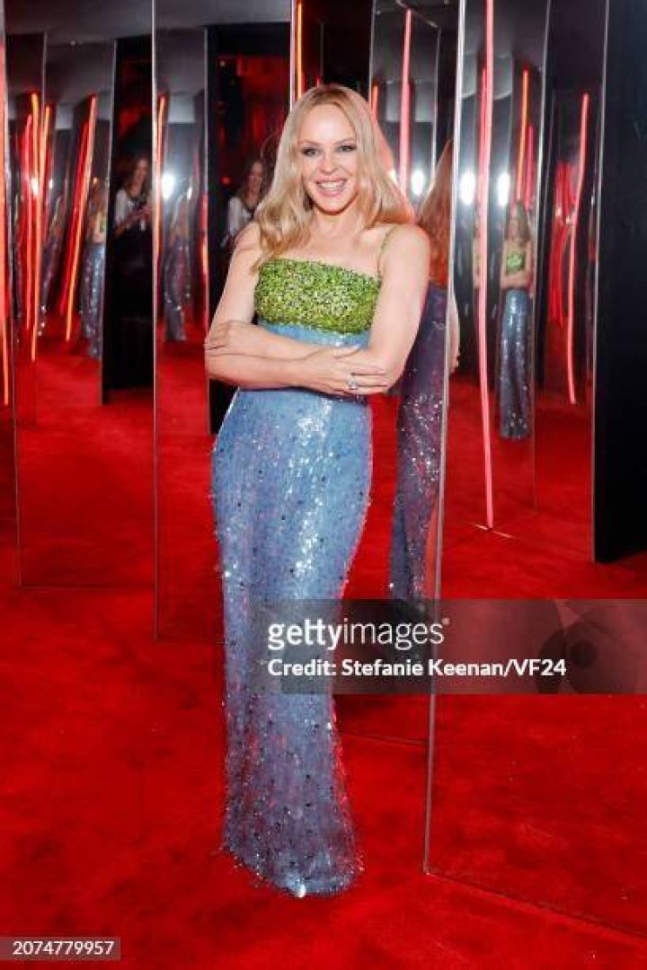 Kylie Minogue, Quinta Brunson, Uzo Aduba; Tan France, Riz Ahmed, and Joey King pose together at the 2024 Vanity Fair Oscar Party