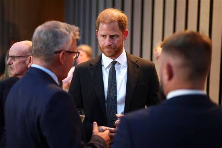 (L) Prince Harry attends an exhibition in England (R) Carson Wentz on the field