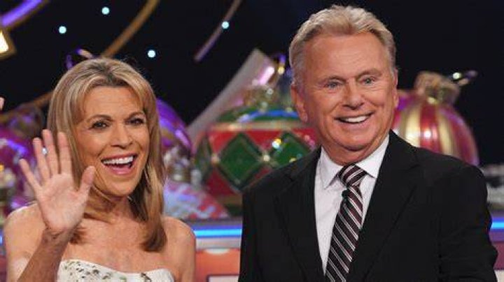 Pat Sajak and Vanna White from 'Wheel of Fortune' smiling at the Hollywood Walk of Fame