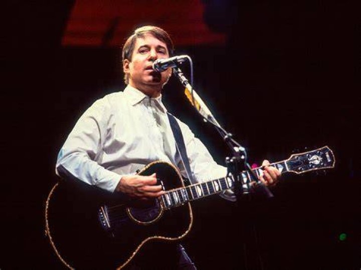 Paul Simon with a guitar