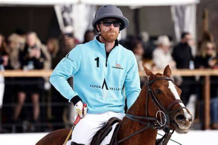 Prince Harry rides in a coach with Prince Philip and Queen Elizabeth in 2016.
