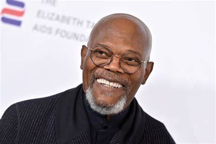 Samuel L. Jackson posing in a suit at the the 95th Annual Academy Awards.