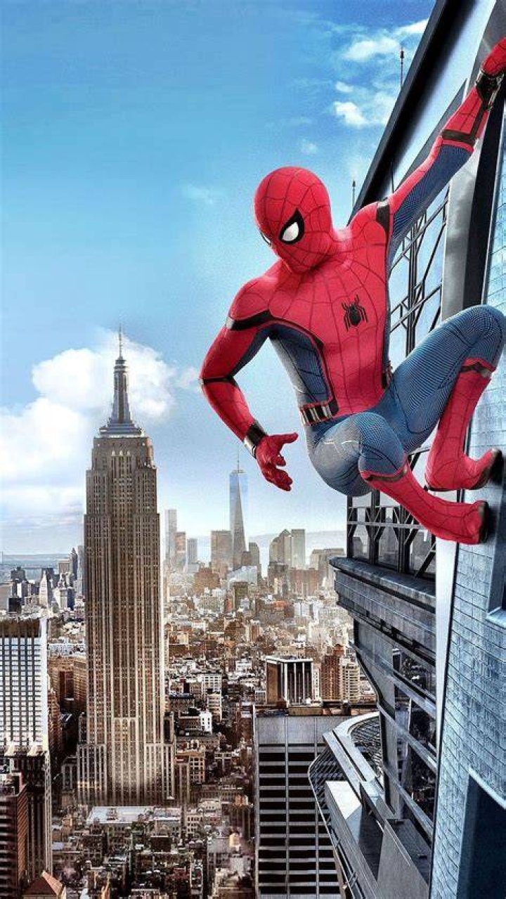 Spider-Man climbing a building.
