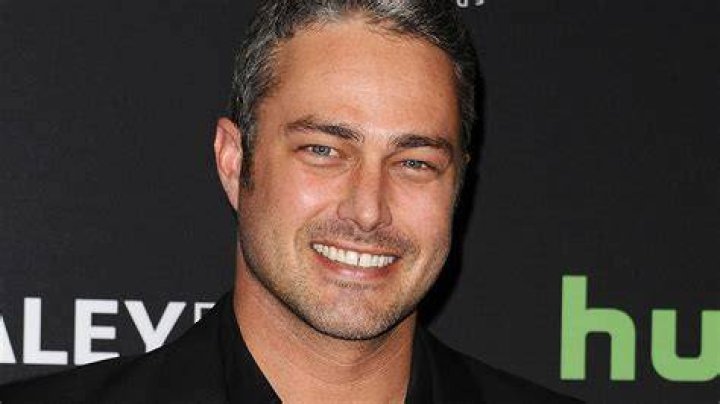 Taylor Kinney as Kelly Severide and Miranda Rae Mayo as Stella Kidd standing next to each other