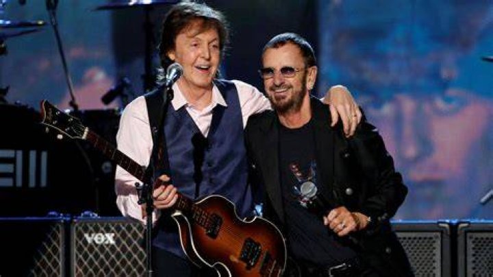 The Beatles’ Paul McCartney, Ringo Starr, John Lennon, and George Harrison standing in a row