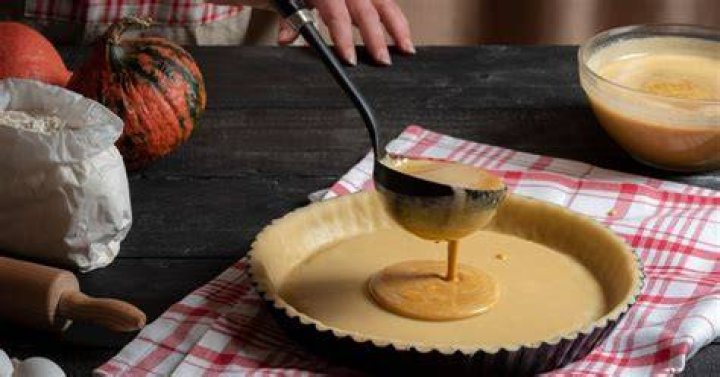 What consistency should pumpkin pie filling be before baking?